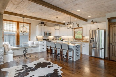 Experience breathtaking long-range mountain views and a serene on Sapphire National Golf Club in North Carolina - for sale on GolfHomes.com, golf home, golf lot