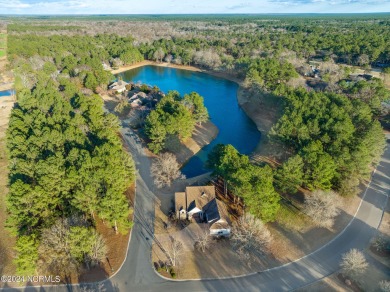 Crafted by the skilled custom home builder Mike Page, this on River Landing Golf Course in North Carolina - for sale on GolfHomes.com, golf home, golf lot