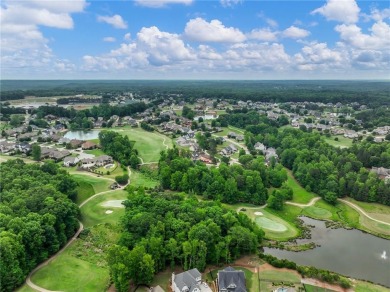 This lovely cottage-style home overlooks the 4th Fairway on on Traditions of Braselton Golf Club in Georgia - for sale on GolfHomes.com, golf home, golf lot