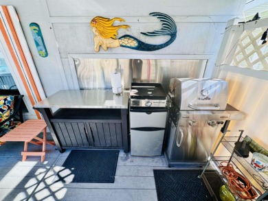 SURF SHACK BEACH HOUSE IN OCEAN LAKES WITH ABUNDANT OUTDOOR on Prestwick Country Club in South Carolina - for sale on GolfHomes.com, golf home, golf lot