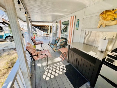 SURF SHACK BEACH HOUSE IN OCEAN LAKES WITH ABUNDANT OUTDOOR on Prestwick Country Club in South Carolina - for sale on GolfHomes.com, golf home, golf lot