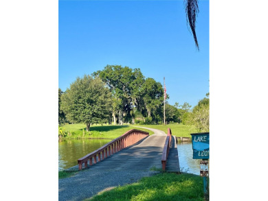 Country living at its finest on this half acre lot in this gated on Indian Lake Estates Golf and Country Club in Florida - for sale on GolfHomes.com, golf home, golf lot