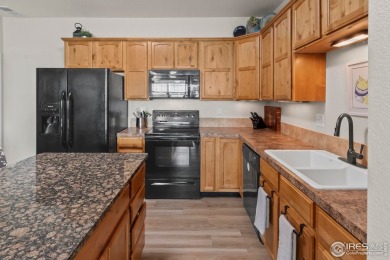 Welcome to this stunning Summer Park end-unit, ground-floor on Boomerang Links in Colorado - for sale on GolfHomes.com, golf home, golf lot