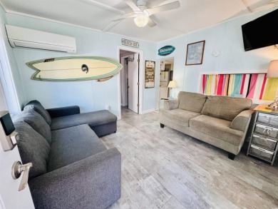 SURF SHACK BEACH HOUSE IN OCEAN LAKES WITH ABUNDANT OUTDOOR on Prestwick Country Club in South Carolina - for sale on GolfHomes.com, golf home, golf lot