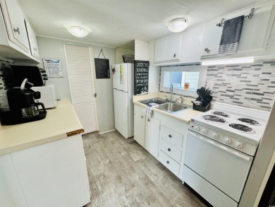 SURF SHACK BEACH HOUSE IN OCEAN LAKES WITH ABUNDANT OUTDOOR on Prestwick Country Club in South Carolina - for sale on GolfHomes.com, golf home, golf lot