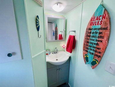 SURF SHACK BEACH HOUSE IN OCEAN LAKES WITH ABUNDANT OUTDOOR on Prestwick Country Club in South Carolina - for sale on GolfHomes.com, golf home, golf lot