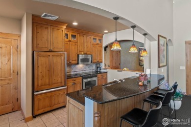 Welcome to this stunning Summer Park end-unit, ground-floor on Boomerang Links in Colorado - for sale on GolfHomes.com, golf home, golf lot