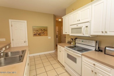 Incredibly well-maintained top floor condo overlooking the golf on Sea Trail Golf Resort in North Carolina - for sale on GolfHomes.com, golf home, golf lot