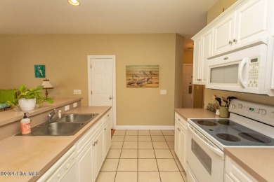 Incredibly well-maintained top floor condo overlooking the golf on Sea Trail Golf Resort in North Carolina - for sale on GolfHomes.com, golf home, golf lot