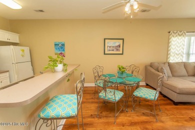 Incredibly well-maintained top floor condo overlooking the golf on Sea Trail Golf Resort in North Carolina - for sale on GolfHomes.com, golf home, golf lot
