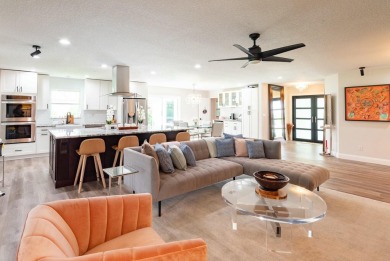 MOVE IN READY - NEWLY DESIGNED  3 BEDROOM/3 BATH POOL HOME ON on Yacht and Country Club in Florida - for sale on GolfHomes.com, golf home, golf lot