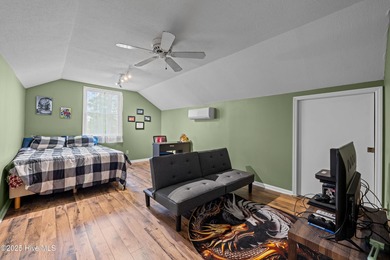 Welcome to your dream escape on the water! Nestled on wooded 2 on River Bend Golf and Country Club in North Carolina - for sale on GolfHomes.com, golf home, golf lot