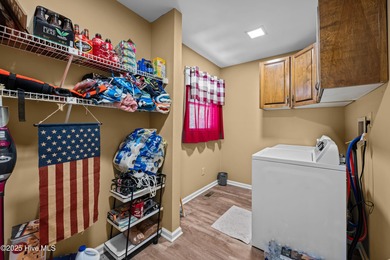 Welcome to your dream escape on the water! Nestled on wooded 2 on River Bend Golf and Country Club in North Carolina - for sale on GolfHomes.com, golf home, golf lot