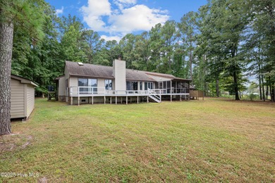 Welcome to your dream escape on the water! Nestled on wooded 2 on River Bend Golf and Country Club in North Carolina - for sale on GolfHomes.com, golf home, golf lot