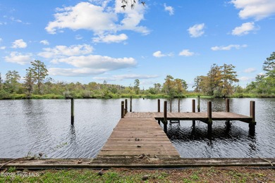 Welcome to your dream escape on the water! Nestled on wooded 2 on River Bend Golf and Country Club in North Carolina - for sale on GolfHomes.com, golf home, golf lot