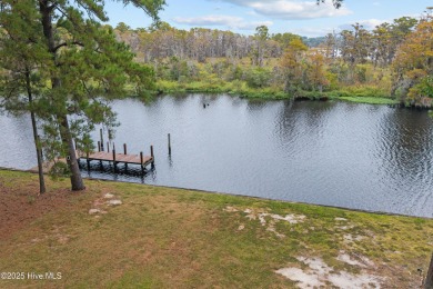 Welcome to your dream escape on the water! Nestled on wooded 2 on River Bend Golf and Country Club in North Carolina - for sale on GolfHomes.com, golf home, golf lot