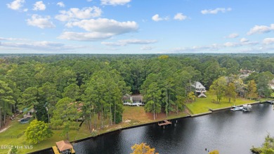 Welcome to your dream escape on the water! Nestled on wooded 2 on River Bend Golf and Country Club in North Carolina - for sale on GolfHomes.com, golf home, golf lot