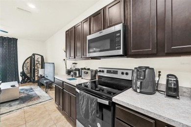 This Atria at Ridgewood Lakes contemporary two-story townhome is on Ridgewood Lakes Golf and Country Club in Florida - for sale on GolfHomes.com, golf home, golf lot