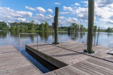 Welcome to your dream escape on the water! Nestled on wooded 2 on River Bend Golf and Country Club in North Carolina - for sale on GolfHomes.com, golf home, golf lot