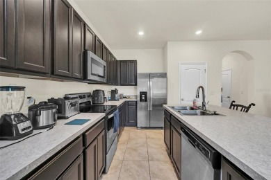 This Atria at Ridgewood Lakes contemporary two-story townhome is on Ridgewood Lakes Golf and Country Club in Florida - for sale on GolfHomes.com, golf home, golf lot