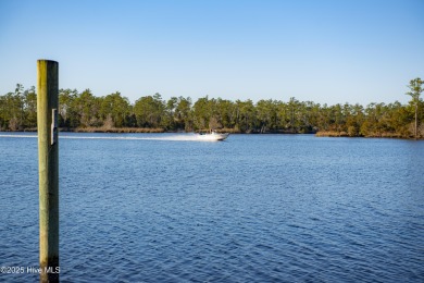 Welcome to your dream escape on the water! Nestled on wooded 2 on River Bend Golf and Country Club in North Carolina - for sale on GolfHomes.com, golf home, golf lot