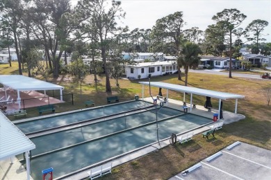 PRICE TO SELL!!! Holiday Park: A 55+ GATED COMMUNITY. CORNER LOT on Sabal Trace Golf and Country Club in Florida - for sale on GolfHomes.com, golf home, golf lot