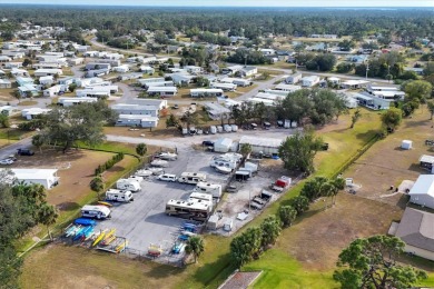 PRICE TO SELL!!! Holiday Park: A 55+ GATED COMMUNITY. CORNER LOT on Sabal Trace Golf and Country Club in Florida - for sale on GolfHomes.com, golf home, golf lot