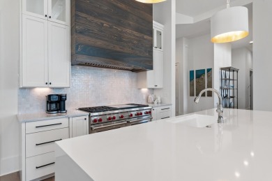 Welcome to 298 Corinthian Place, where elegance meets on Regatta Bay Golf and Country Club in Florida - for sale on GolfHomes.com, golf home, golf lot