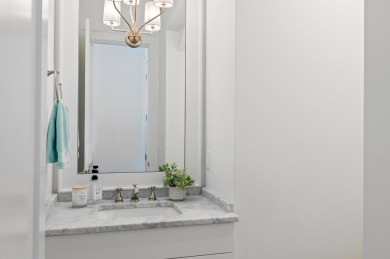 Welcome to 298 Corinthian Place, where elegance meets on Regatta Bay Golf and Country Club in Florida - for sale on GolfHomes.com, golf home, golf lot