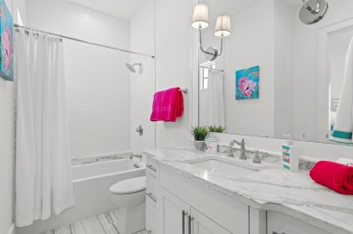 Welcome to 298 Corinthian Place, where elegance meets on Regatta Bay Golf and Country Club in Florida - for sale on GolfHomes.com, golf home, golf lot