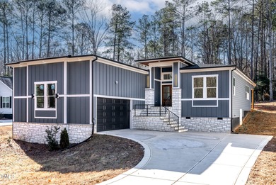 MODERN LUXURY LIVING AT LAKE ROYALE! This custom-built 3BR/3BA on River Golf and County Club at Lake Royale in North Carolina - for sale on GolfHomes.com, golf home, golf lot