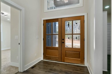 MODERN LUXURY LIVING AT LAKE ROYALE! This custom-built 3BR/3BA on River Golf and County Club at Lake Royale in North Carolina - for sale on GolfHomes.com, golf home, golf lot