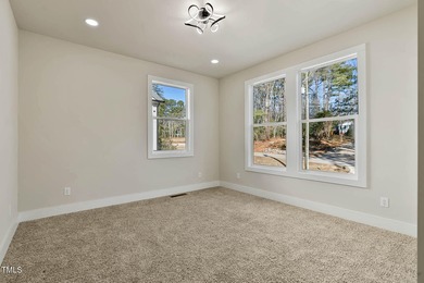 MODERN LUXURY LIVING AT LAKE ROYALE! This custom-built 3BR/3BA on River Golf and County Club at Lake Royale in North Carolina - for sale on GolfHomes.com, golf home, golf lot