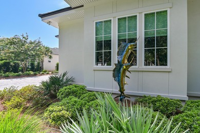 Welcome to 298 Corinthian Place, where elegance meets on Regatta Bay Golf and Country Club in Florida - for sale on GolfHomes.com, golf home, golf lot