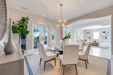 Situated on a prime end lot beside the golf course, this fully on Deering Bay Yacht and Country Club in Florida - for sale on GolfHomes.com, golf home, golf lot