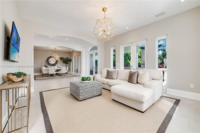 Situated on a prime end lot beside the golf course, this fully on Deering Bay Yacht and Country Club in Florida - for sale on GolfHomes.com, golf home, golf lot