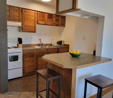 Bright, Fresh, Convenient, Affordable-- All describe this condo on Big Sky of Montana Golf Course in Montana - for sale on GolfHomes.com, golf home, golf lot