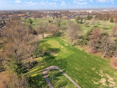 Situated on the 16th hole of Elk Run Golf Course, this spacious on Jeffersonville Elks Golf Club in Indiana - for sale on GolfHomes.com, golf home, golf lot