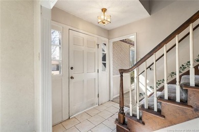 Situated on the 16th hole of Elk Run Golf Course, this spacious on Jeffersonville Elks Golf Club in Indiana - for sale on GolfHomes.com, golf home, golf lot