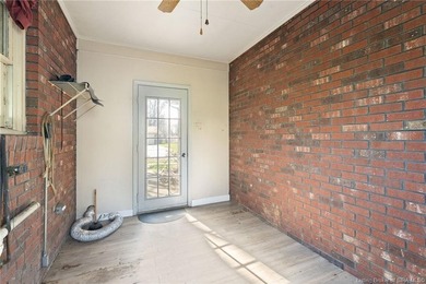 Situated on the 16th hole of Elk Run Golf Course, this spacious on Jeffersonville Elks Golf Club in Indiana - for sale on GolfHomes.com, golf home, golf lot