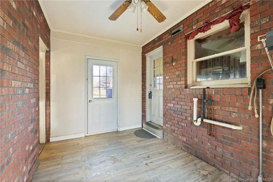 Situated on the 16th hole of Elk Run Golf Course, this spacious on Jeffersonville Elks Golf Club in Indiana - for sale on GolfHomes.com, golf home, golf lot