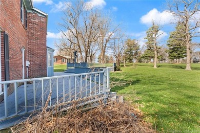 Situated on the 16th hole of Elk Run Golf Course, this spacious on Jeffersonville Elks Golf Club in Indiana - for sale on GolfHomes.com, golf home, golf lot