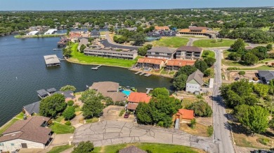 This charming waterfront condo offers a fantastic opportunity to on De Cordova Bend Country Club in Texas - for sale on GolfHomes.com, golf home, golf lot