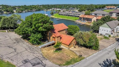 This charming waterfront condo offers a fantastic opportunity to on De Cordova Bend Country Club in Texas - for sale on GolfHomes.com, golf home, golf lot
