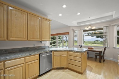 Nestled in a gated golf course community and overlooking serene on Genoa Lakes Golf Club - Lakes Course in Nevada - for sale on GolfHomes.com, golf home, golf lot