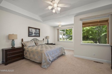 Nestled in a gated golf course community and overlooking serene on Genoa Lakes Golf Club - Lakes Course in Nevada - for sale on GolfHomes.com, golf home, golf lot