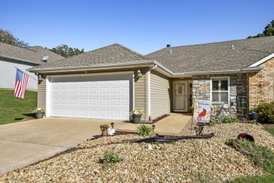 Perched overlooking the golf course, this  two-bedroom on Pointe Royale Village Country Club in Missouri - for sale on GolfHomes.com, golf home, golf lot