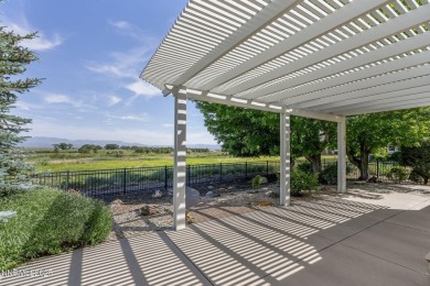 Nestled in a gated golf course community and overlooking serene on Genoa Lakes Golf Club - Lakes Course in Nevada - for sale on GolfHomes.com, golf home, golf lot