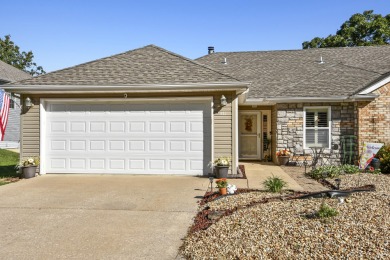 Perched overlooking the golf course, this  two-bedroom on Pointe Royale Village Country Club in Missouri - for sale on GolfHomes.com, golf home, golf lot