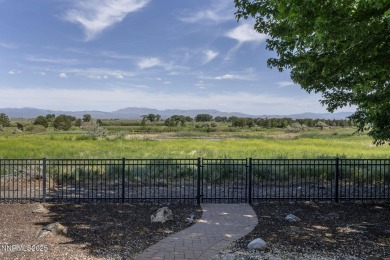 Nestled in a gated golf course community and overlooking serene on Genoa Lakes Golf Club - Lakes Course in Nevada - for sale on GolfHomes.com, golf home, golf lot